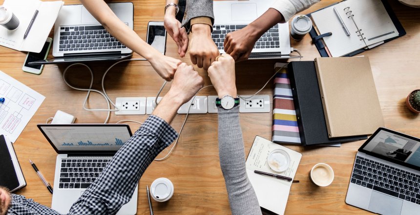 Colleagues giving a fist bump